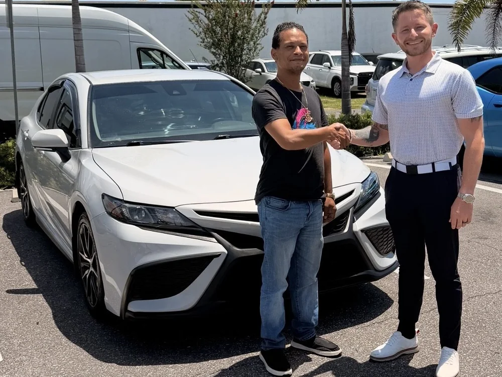 Client shaking hands on his new Toyota Camry
